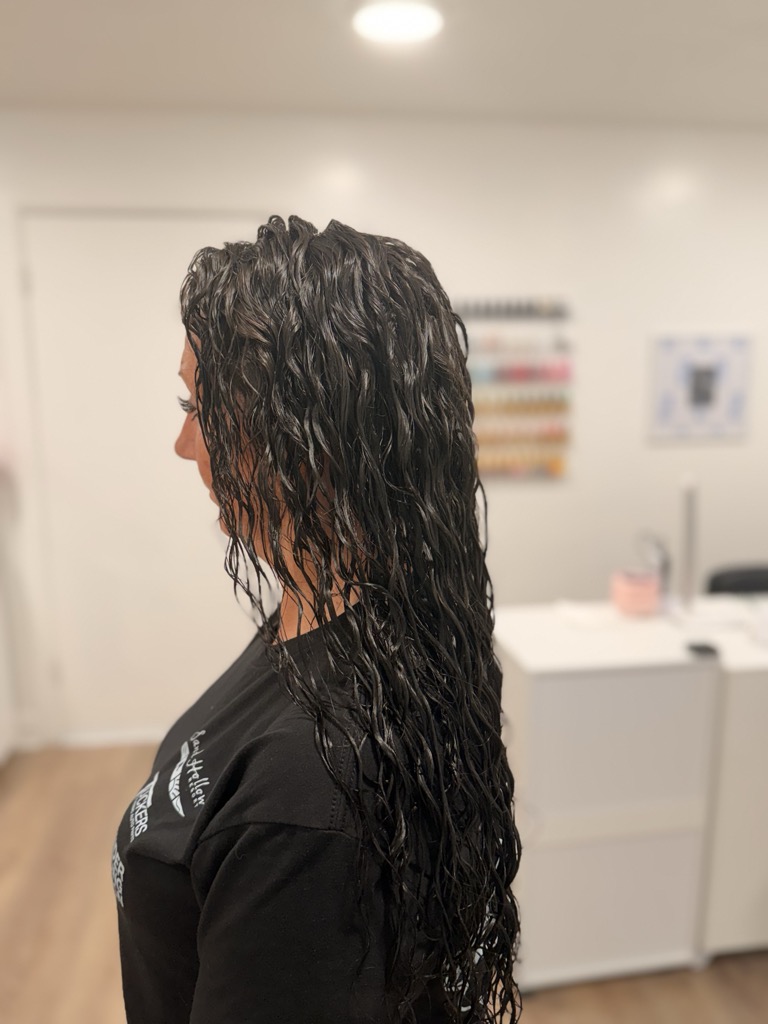 Long dark curly perm result